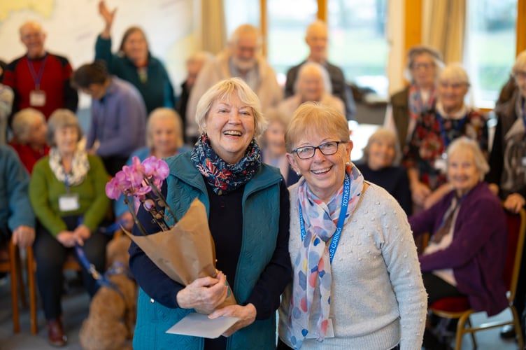 Susie Creak was presented with a thank-you gift by Memory Cafe manager Mary Garvey.